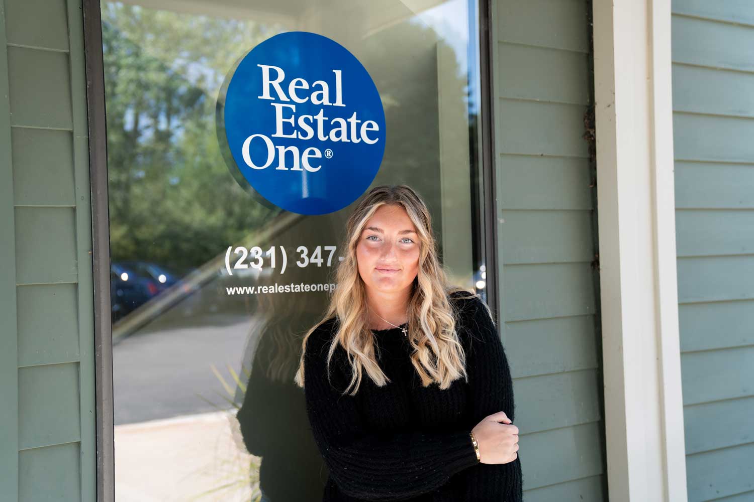 Photo of Lillian Sabin outside Real Estate One office