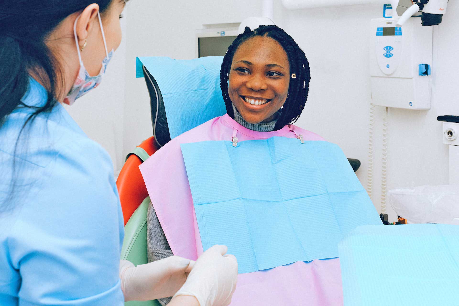 Dental assistant with patient