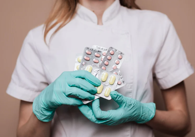 woman holding medication