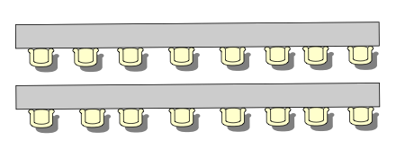 Two long tables with 8 chairs facing the same direction