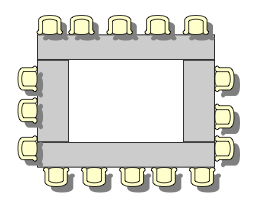 4 tables in 'box' formation with 2 shorter tables and 2 longer table. 16 chairs are under the table on the outside of the 'box'