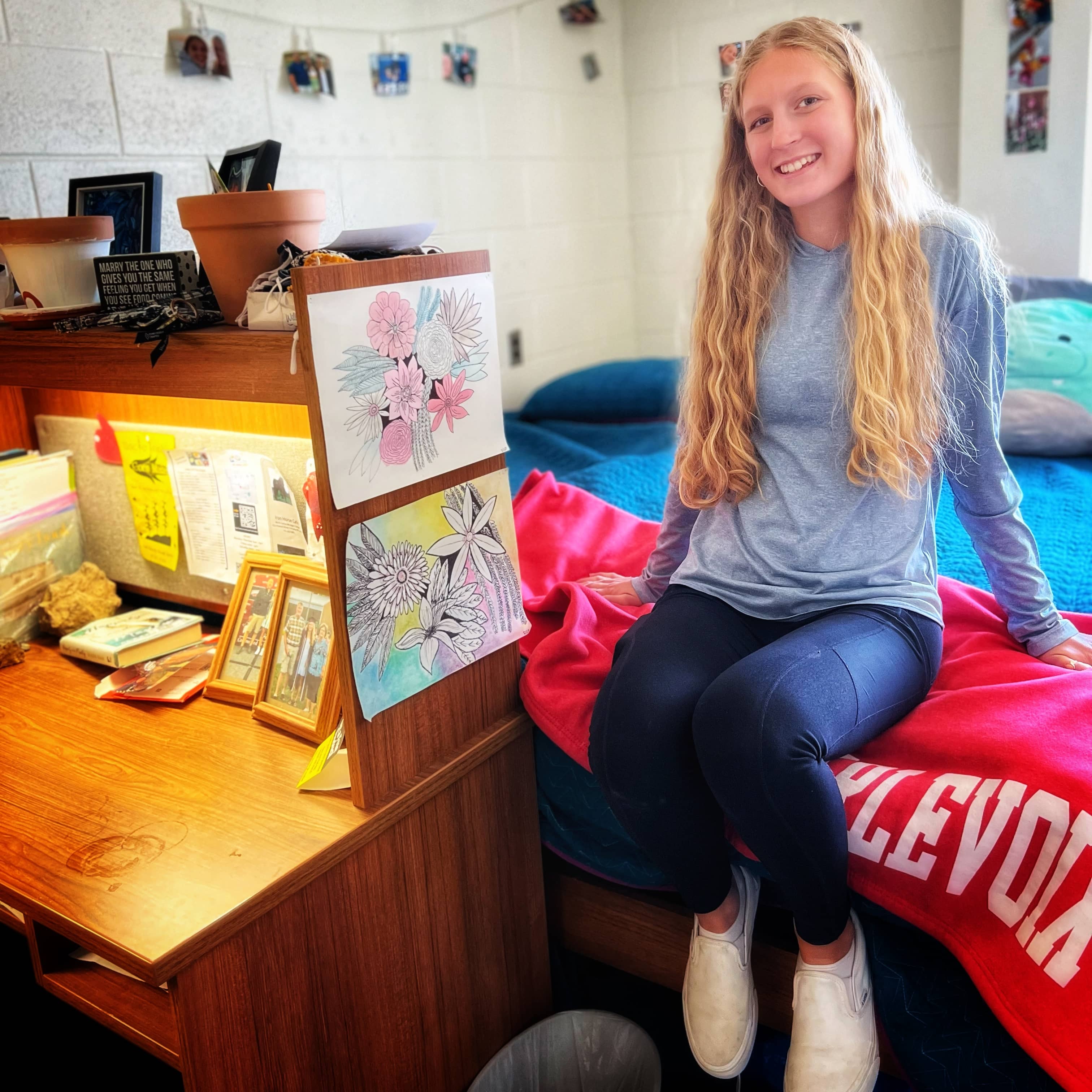 Female college student sitting in dorm room