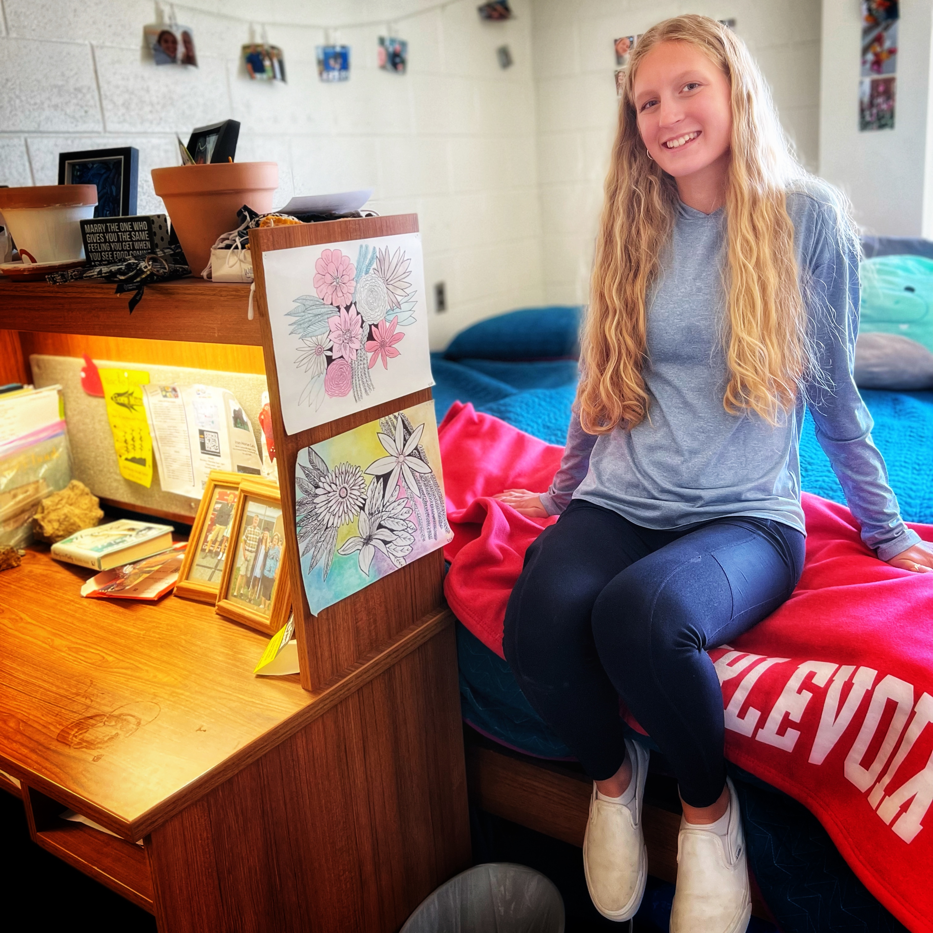 Female college student sitting in dorm room