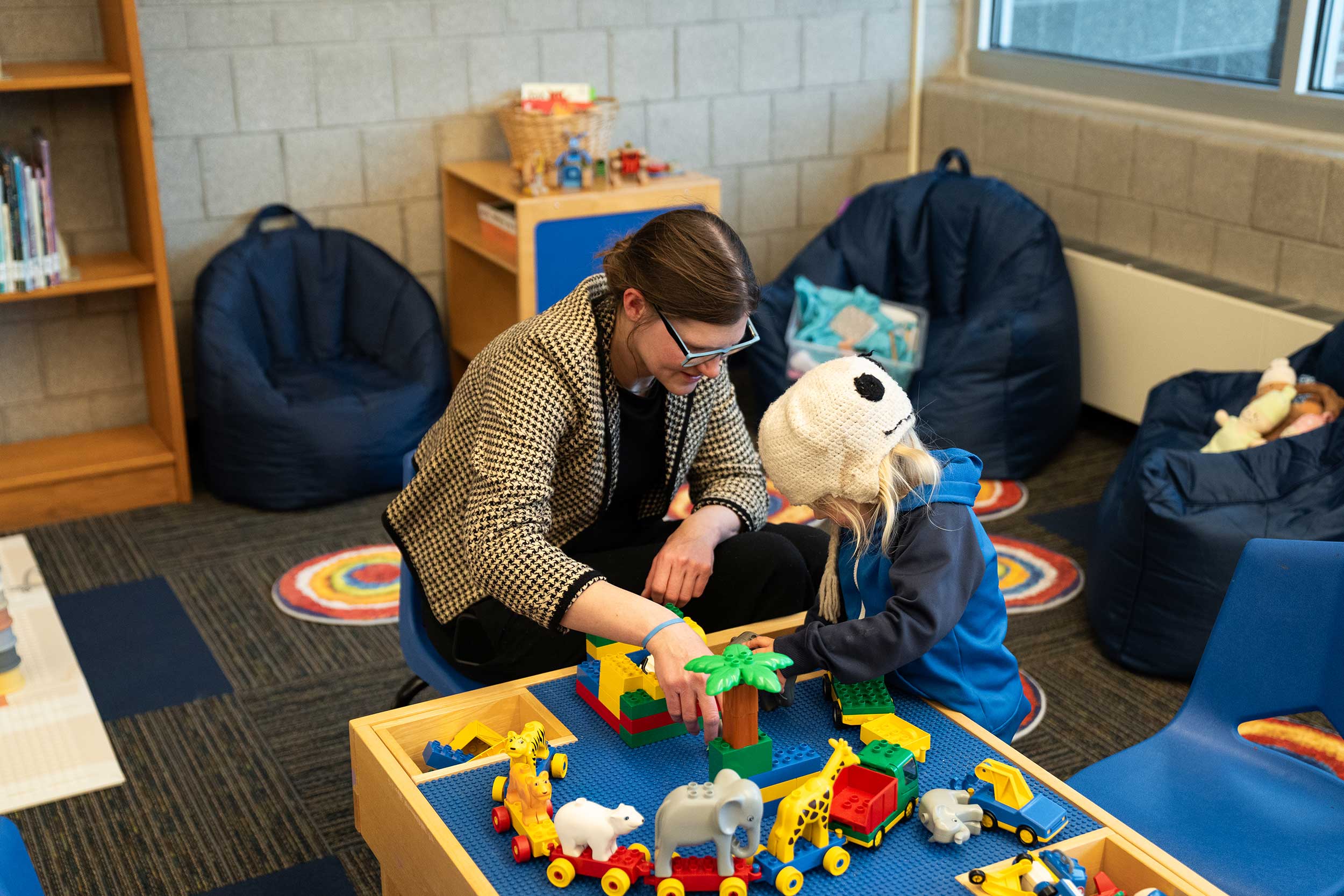 Adult and children, playing