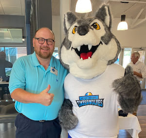 Doug Tippett with Timberwolf Mascot