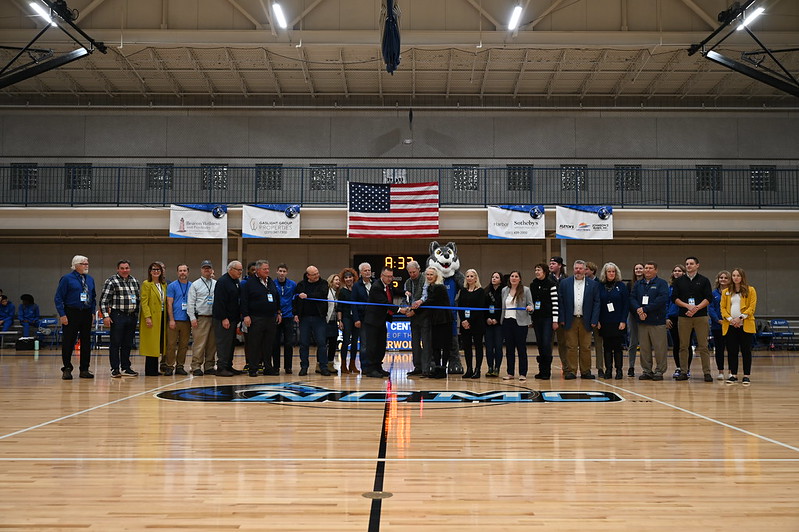 Group ribbon-cutting photo