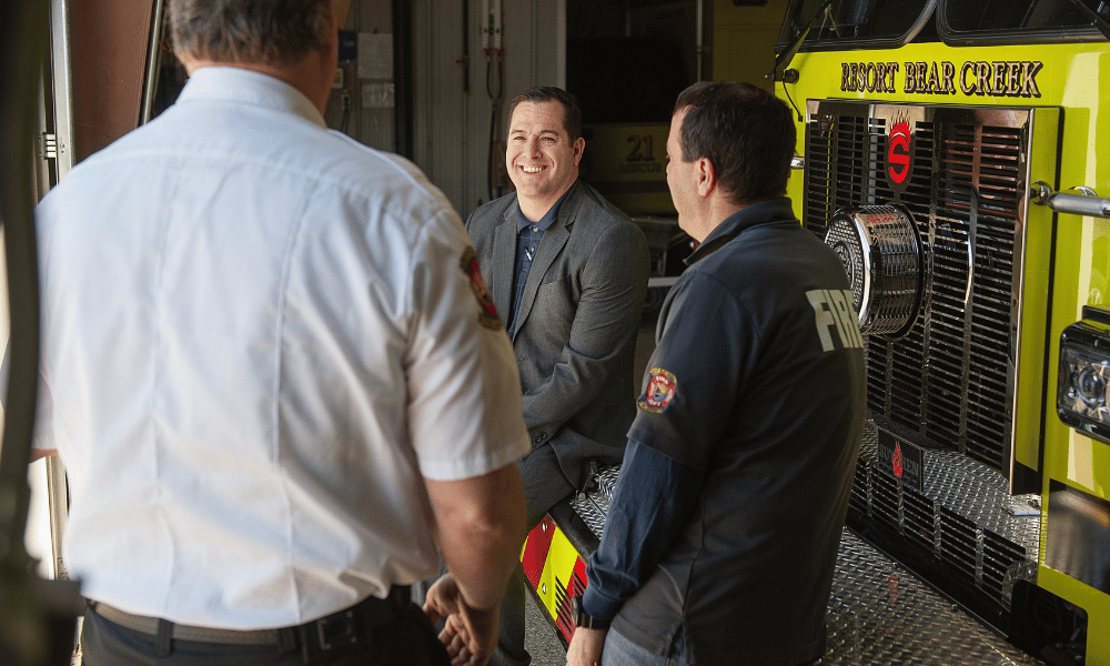 Firefighter in conversation, smiling
