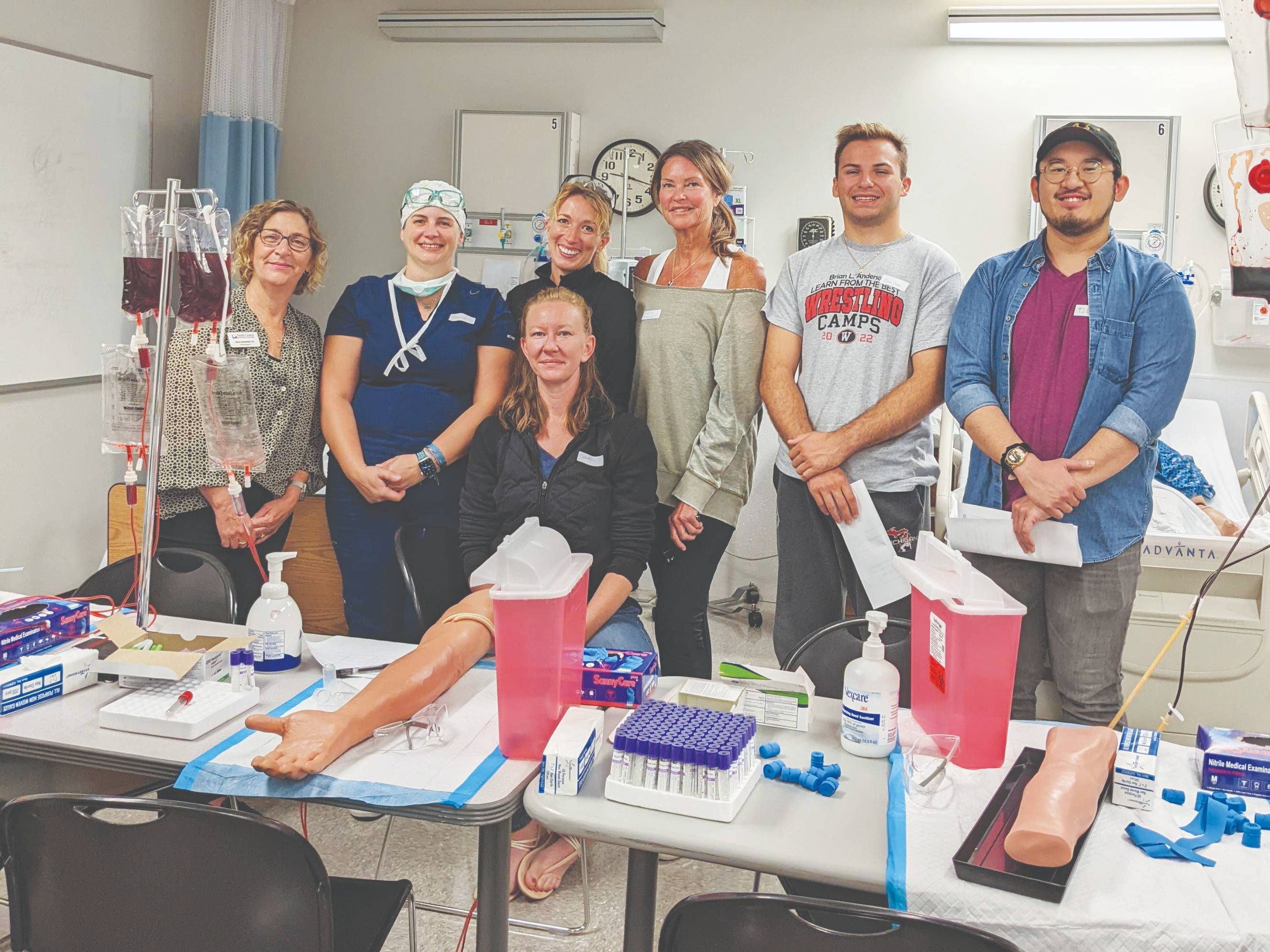 Medical students posing in front of lab table