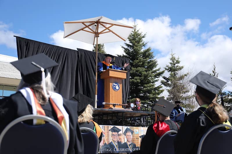 President Finley speaking from podium