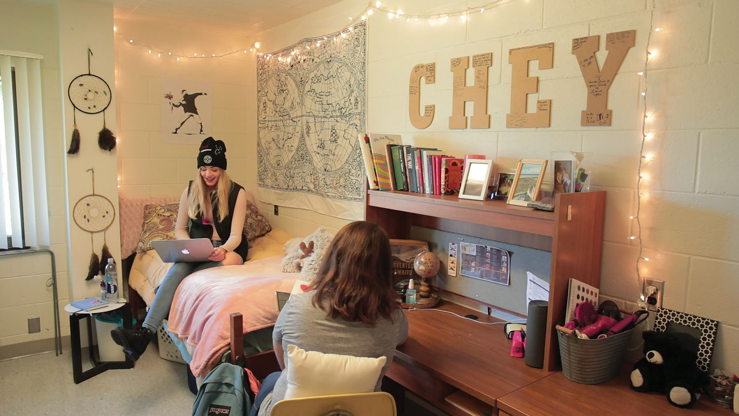 Two students sitting in dorm room