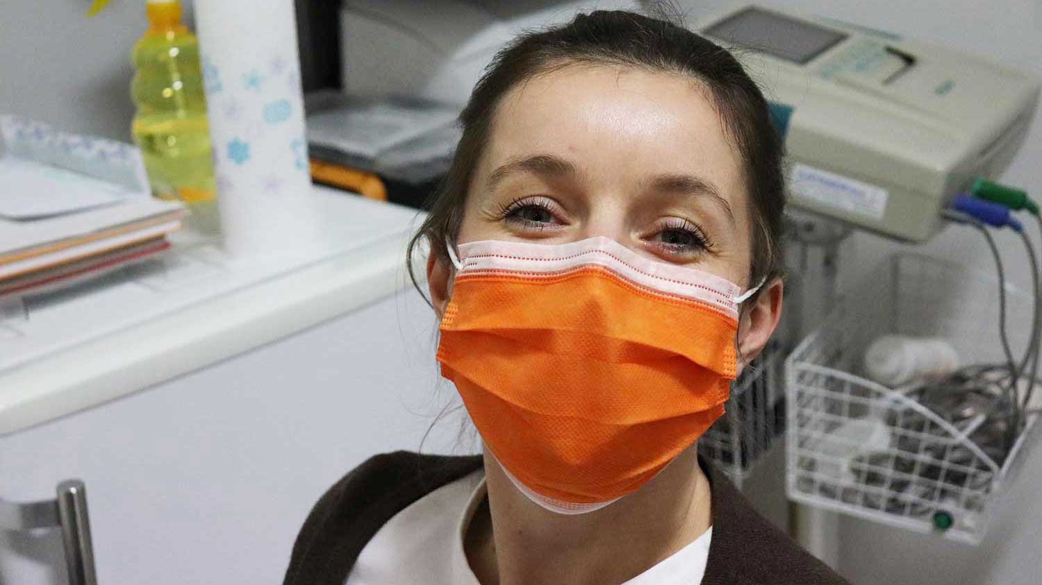 Nurse wearing an orange mask