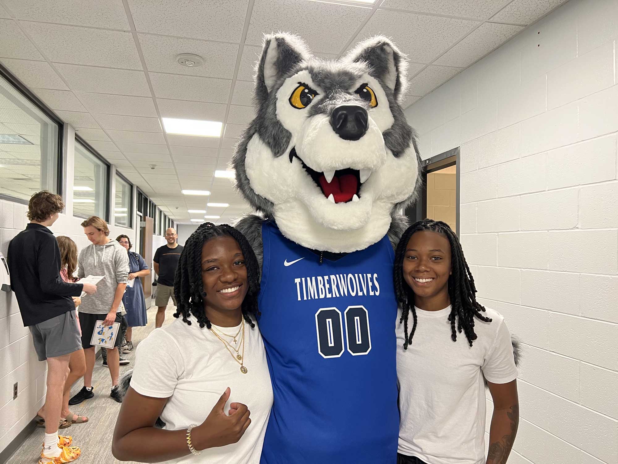 NCMC Students standing with Timberwolf Mascot