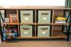 Photo of console table with cubbies containing journals, coloring books, fidgets, puzzles, and books